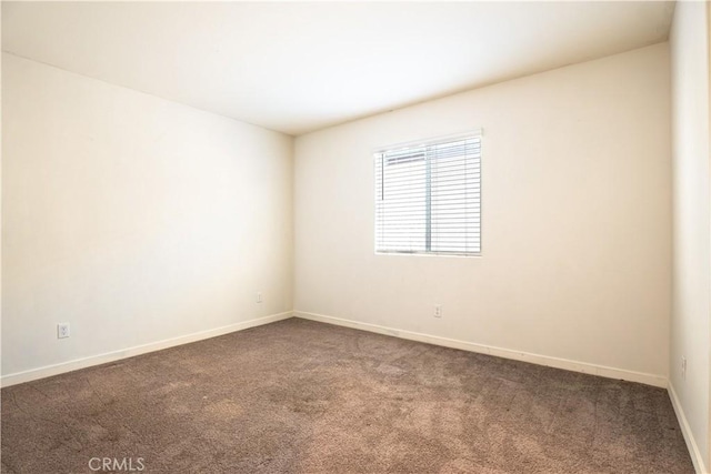 12893 Breccia Way, Moreno Valley, CA 92555 - carpeted empty room featuring baseboards