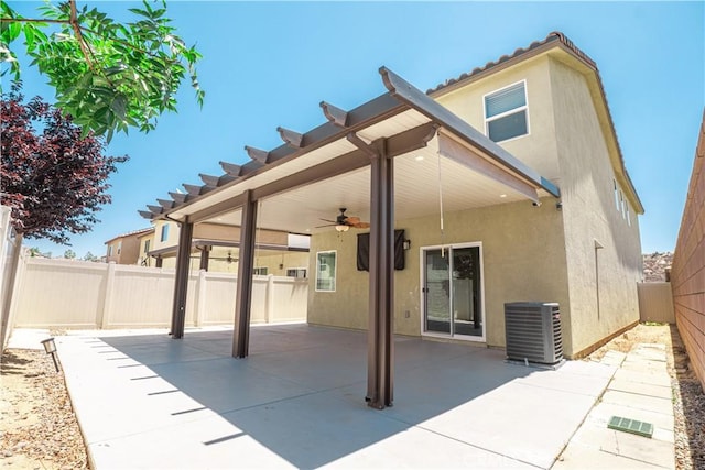 12893 Breccia Way, Moreno Valley, CA 92555 - back of house featuring ceiling fan, stucco siding, a patio, and a fenced backyard