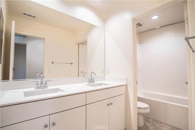 12893 Breccia Way, Moreno Valley, CA 92555 - full bathroom with double vanity, bathtub / shower combination, and recessed lighting
