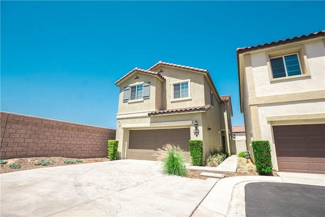 12893 Breccia Way, Moreno Valley, CA 92555 - view of front of house with a garage, stucco siding, and concrete driveway