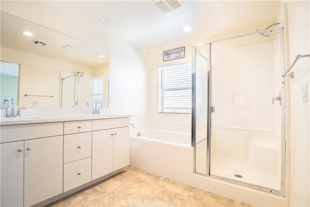 12893 Breccia Way, Moreno Valley, CA 92555 - full bath featuring a shower stall, double vanity, a bath, and recessed lighting