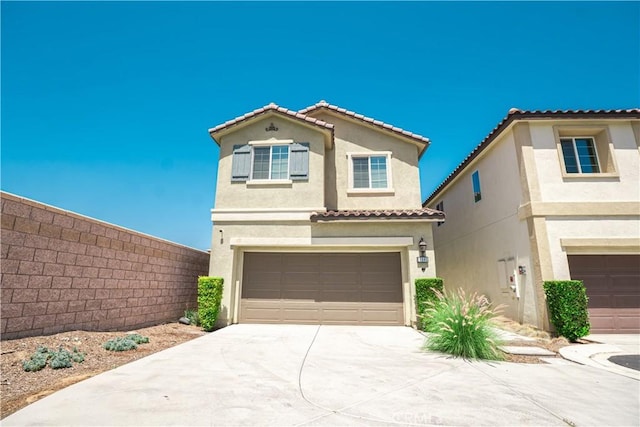 12893 Breccia Way, Moreno Valley, CA 92555 - view of front of property featuring stucco siding, a garage, concrete driveway, and a tile roof