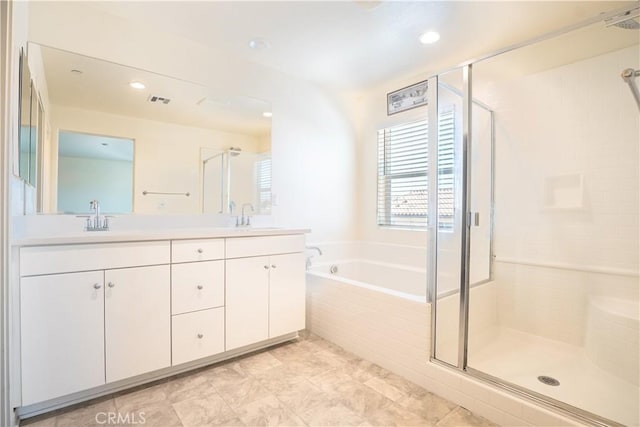 12893 Breccia Way, Moreno Valley, CA 92555 - bathroom with a shower stall, double vanity, a bath, and recessed lighting