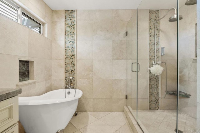 15935 Mac Tan Ln, Valley Center, CA 92082 - full bathroom with tile walls, a shower stall, a freestanding tub, vanity, and tile patterned flooring
