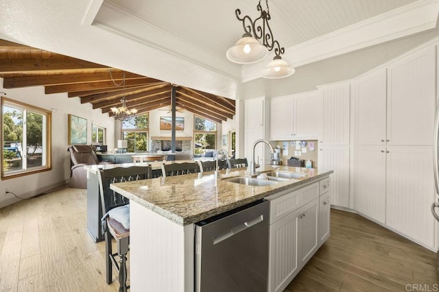 15935 Mac Tan Ln, Valley Center, CA 92082 - kitchen featuring dishwasher, a breakfast bar, white cabinets, and an island with sink