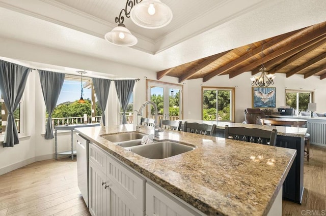 15935 Mac Tan Ln, Valley Center, CA 92082 - kitchen with a center island with sink, hanging light fixtures, a chandelier, light stone countertops, and light wood-style floors