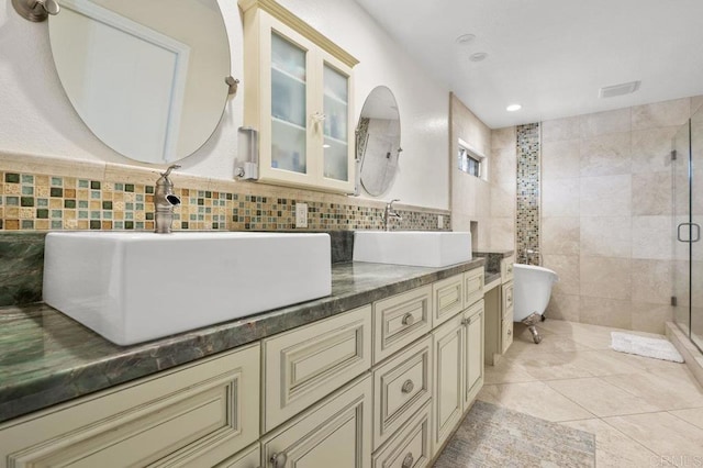 15935 Mac Tan Ln, Valley Center, CA 92082 - full bathroom featuring tile walls, a shower stall, double vanity, a soaking tub, and tile patterned floors