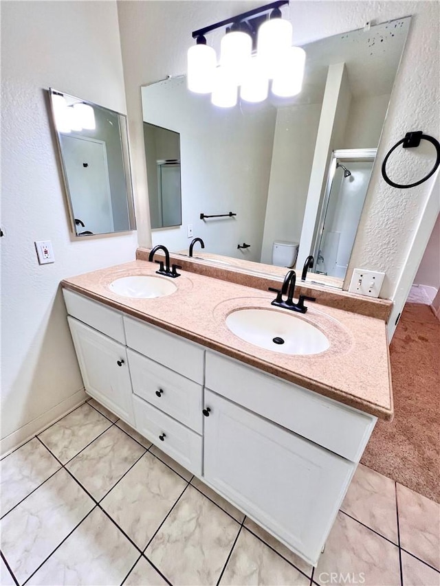 13895 Parkway Dr Unit 79, Garden Grove, CA 92843 - full bathroom featuring double vanity, a textured wall, an enclosed shower, and a chandelier