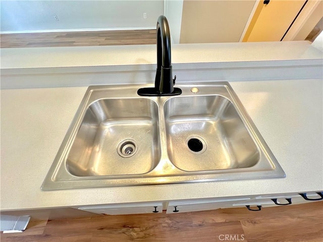 13895 Parkway Dr Unit 79, Garden Grove, CA 92843 - kitchen view of a sink and wood finished floors