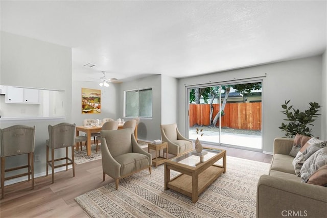 13895 Parkway Dr Unit 79, Garden Grove, CA 92843 - living room featuring wood finished floors and a ceiling fan