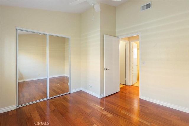 23998 Via Astuto, Murrieta, CA 92562 - unfurnished bedroom with wood finished floors, a closet, and a ceiling fan