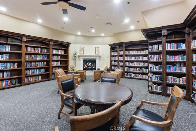23998 Via Astuto, Murrieta, CA 92562 - sitting room with bookshelves, carpet, a ceiling fan, and recessed lighting