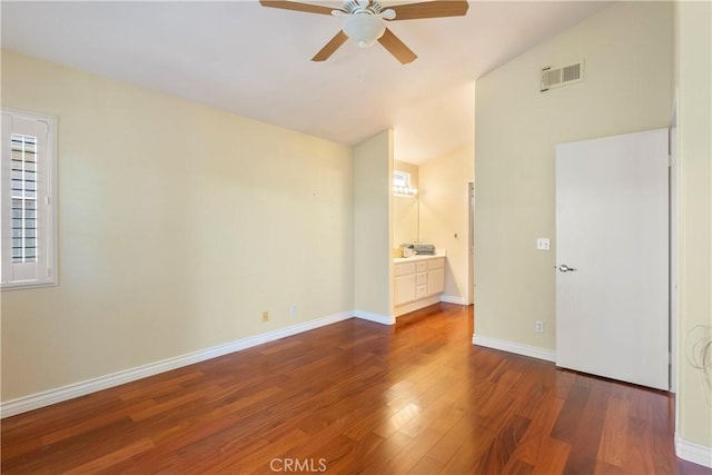23998 Via Astuto, Murrieta, CA 92562 - unfurnished bedroom with vaulted ceiling, wood finished floors, ensuite bath, and a ceiling fan