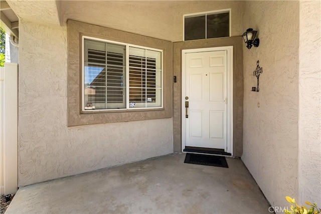23998 Via Astuto, Murrieta, CA 92562 - doorway to property featuring stucco siding