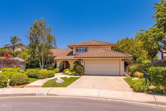 2274 Via Tomas, Camarillo, CA 93010 - mediterranean / spanish-style home with stucco siding, a tile roof, a garage, and driveway