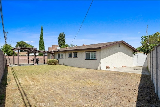 6433 San Marcos Way, Buena Park, CA 90620 - rear view of property featuring stucco siding, a pergola, a fenced backyard, and a gate