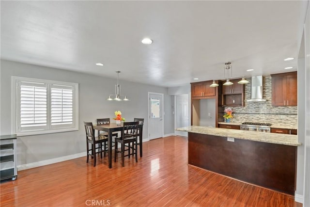 6433 San Marcos Way, Buena Park, CA 90620 - kitchen featuring wall chimney exhaust hood, backsplash, wood finished floors, range, and recessed lighting