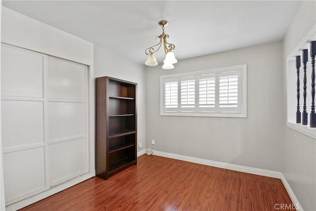 6433 San Marcos Way, Buena Park, CA 90620 - unfurnished dining area with wood finished floors and a chandelier