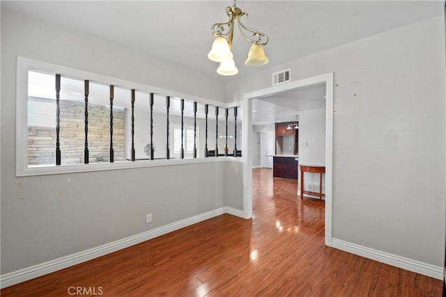 6433 San Marcos Way, Buena Park, CA 90620 - spare room with a chandelier and wood finished floors