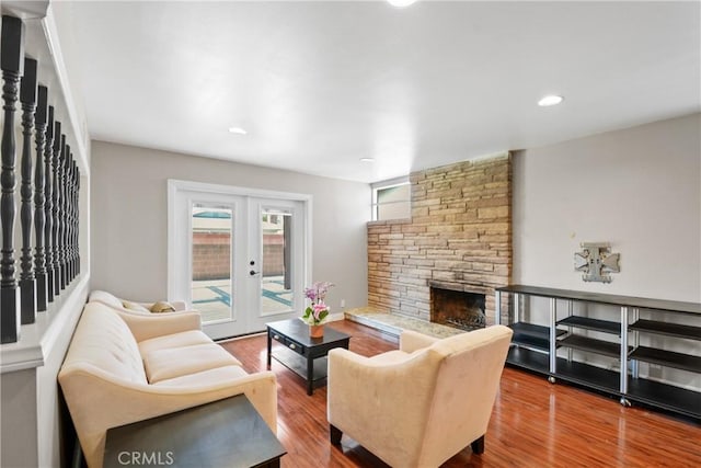 6433 San Marcos Way, Buena Park, CA 90620 - living area featuring a fireplace, wood finished floors, recessed lighting, stairs, and french doors