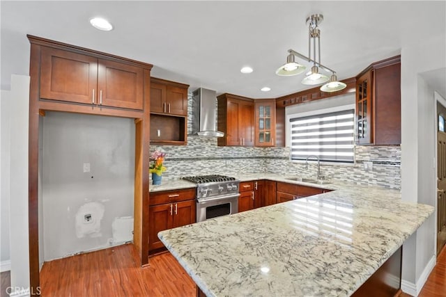6433 San Marcos Way, Buena Park, CA 90620 - kitchen with wall chimney range hood, high end stove, a peninsula, tasteful backsplash, and recessed lighting