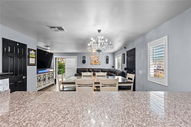 26120 Goldman Pl, Saugus, CA 91350 - kitchen featuring a chandelier, healthy amount of natural light, and wood finished floors