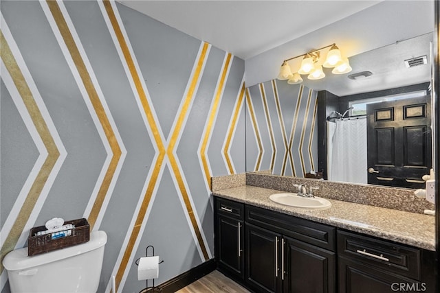 26120 Goldman Pl, Saugus, CA 91350 - full bathroom with vanity, wallpapered walls, and wood finished floors