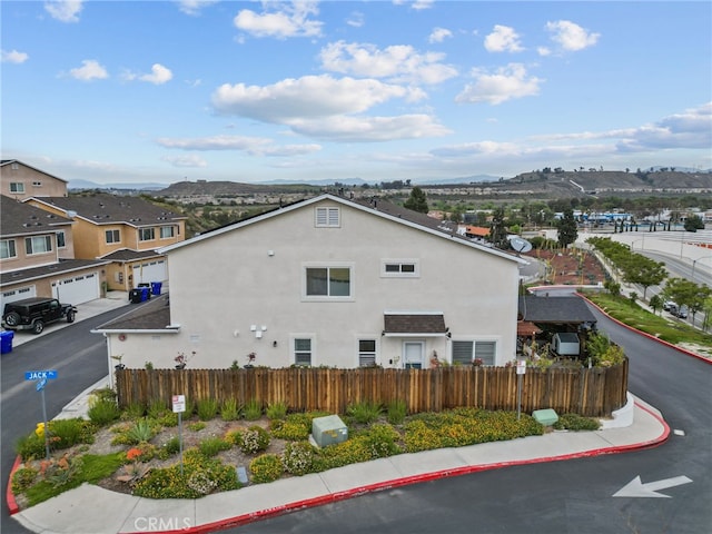 26120 Goldman Pl, Saugus, CA 91350 - view of side of property featuring stucco siding and a mountain view