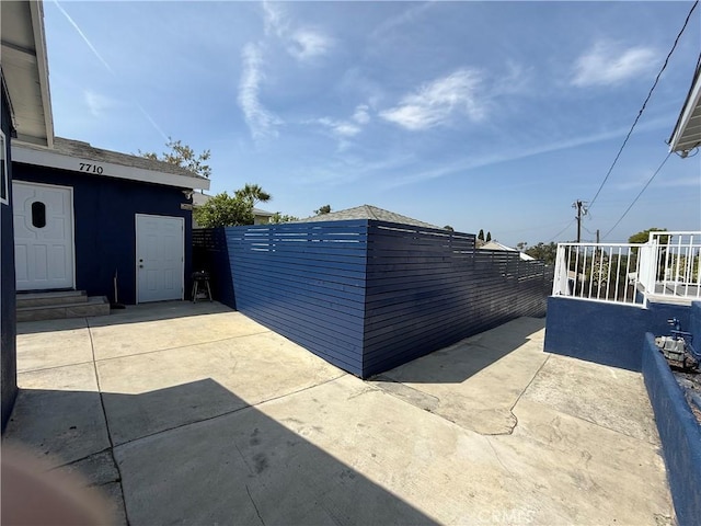 7712 Young Ave, Rosemead, CA 91770 - fenced backyard with a patio area and entry steps
