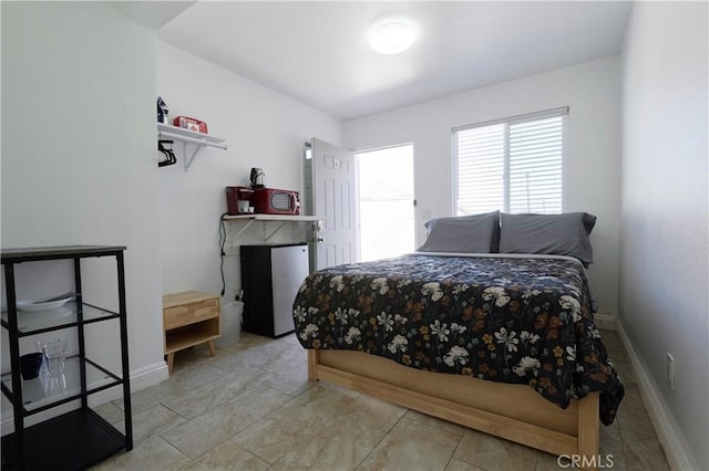 7712 Young Ave, Rosemead, CA 91770 - bedroom featuring freestanding refrigerator and baseboards