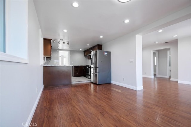 7712 Young Ave, Rosemead, CA 91770 - unfurnished living room featuring dark wood-style floors and recessed lighting