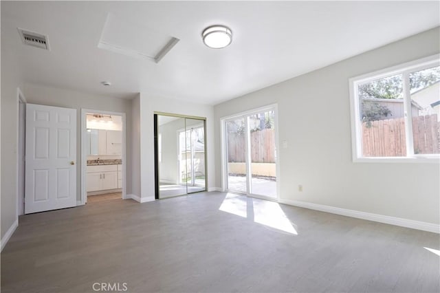 7712 Young Ave, Rosemead, CA 91770 - spare room featuring light wood finished floors, healthy amount of natural light, and attic access