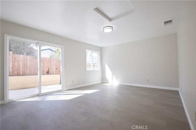 7712 Young Ave, Rosemead, CA 91770 - spare room with attic access and wood finished floors