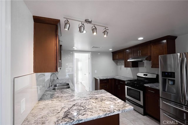 7712 Young Ave, Rosemead, CA 91770 - kitchen featuring stainless steel appliances, under cabinet range hood, light stone countertops, recessed lighting, and dark brown cabinetry