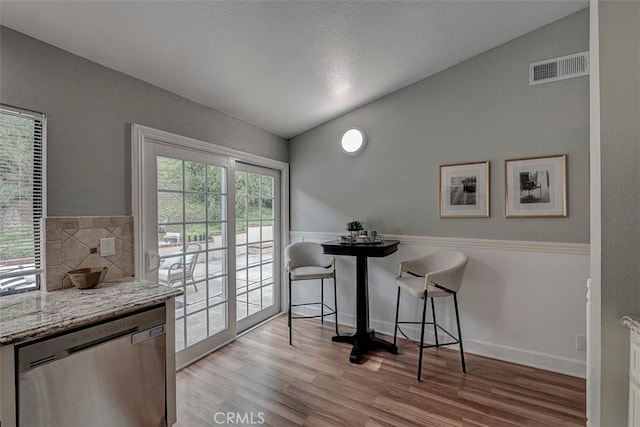 21812 Raintree Ln, Lake Forest, CA 92630 - dining space featuring light wood-type flooring and vaulted ceiling