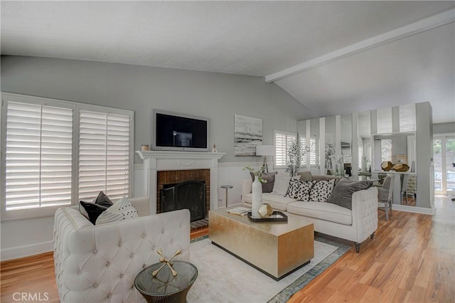 21812 Raintree Ln, Lake Forest, CA 92630 - living area with light wood-style floors and a brick fireplace