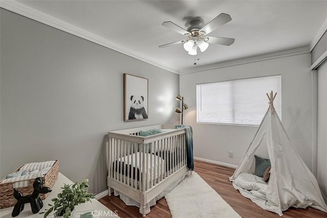 21812 Raintree Ln, Lake Forest, CA 92630 - bedroom with wood finished floors, ornamental molding, a ceiling fan, and a nursery area