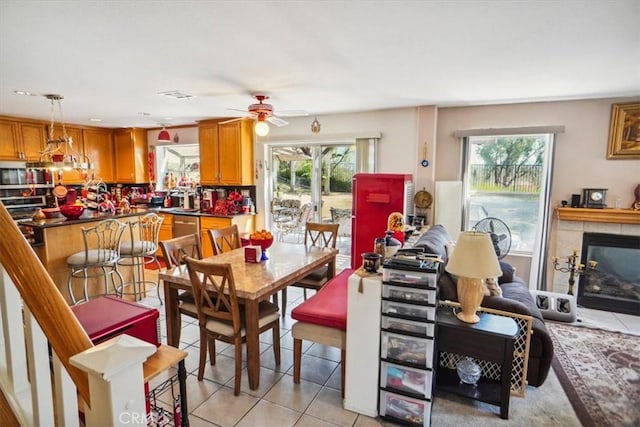 29720 Creekbed Rd, Castaic, CA 91384 - dining space featuring plenty of natural light, light tile patterned flooring, and a ceiling fan
