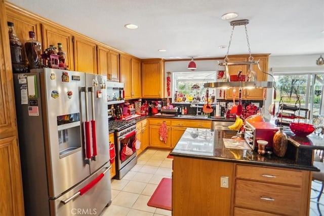 29720 Creekbed Rd, Castaic, CA 91384 - kitchen featuring stainless steel appliances, healthy amount of natural light, light tile patterned flooring, and dark countertops