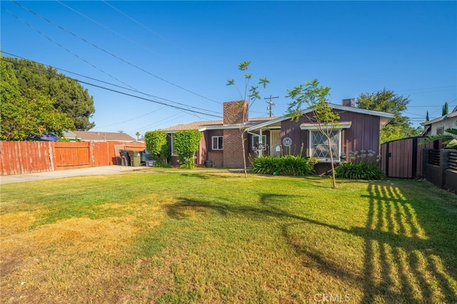 950 E Yale St, Ontario, CA 91764 - rear view of property with a chimney