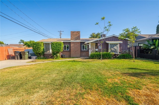 950 E Yale St, Ontario, CA 91764 - view of front of home with a chimney and brick siding