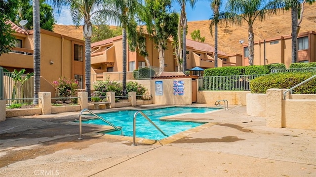 1480 W Edgehill Rd Unit 58, San Bernardino, CA 92405 - community pool with a patio area and a residential view