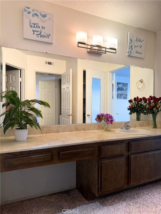 1480 W Edgehill Rd Unit 58, San Bernardino, CA 92405 - bathroom featuring vanity and a textured ceiling