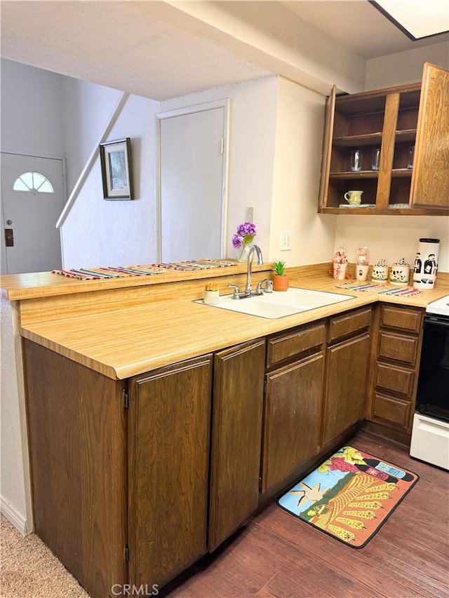1480 W Edgehill Rd Unit 58, San Bernardino, CA 92405 - kitchen with electric stove, light countertops, a peninsula, open shelves, and dark wood-style floors