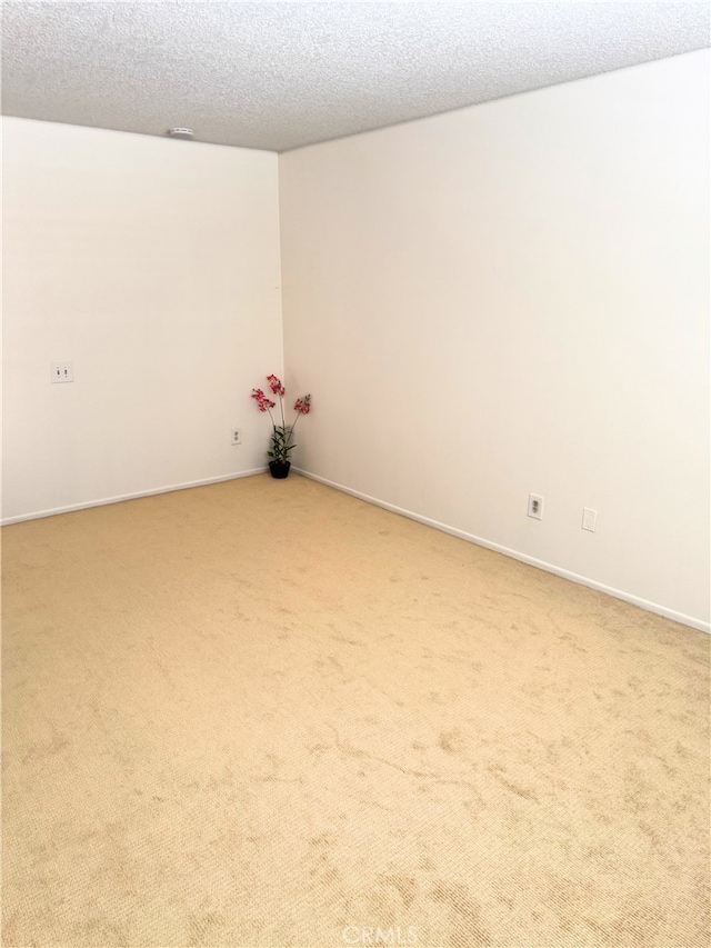 1480 W Edgehill Rd Unit 58, San Bernardino, CA 92405 - spare room with light carpet and a textured ceiling