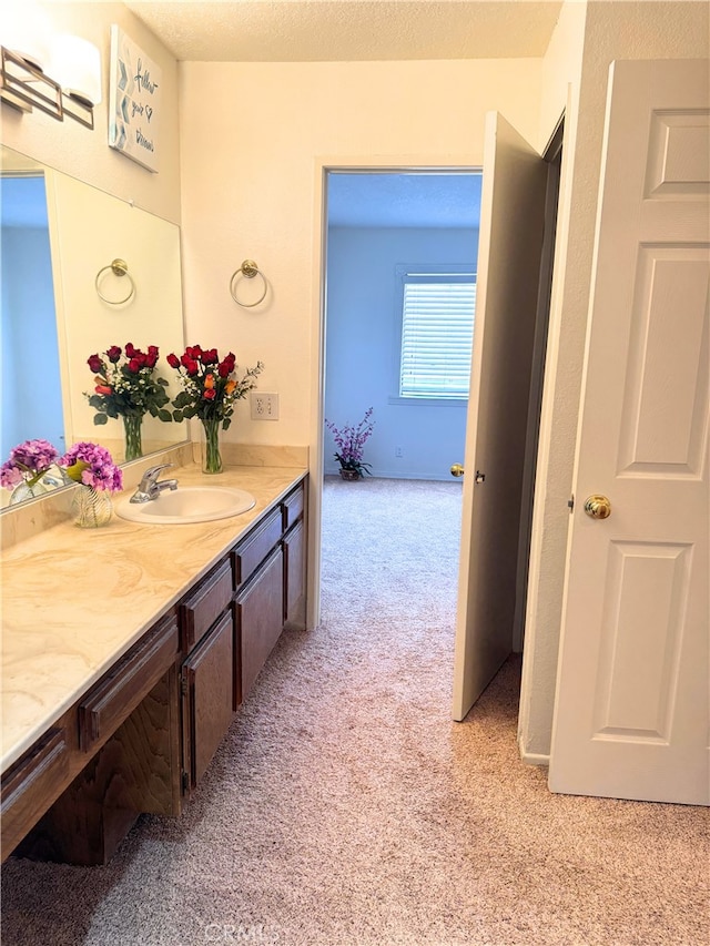 1480 W Edgehill Rd Unit 58, San Bernardino, CA 92405 - bathroom with carpet flooring and vanity