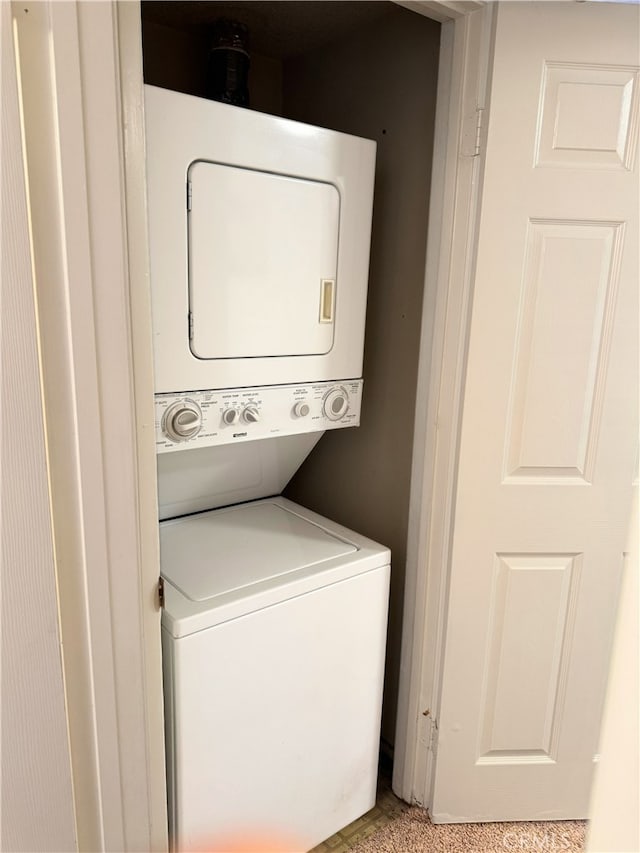 1480 W Edgehill Rd Unit 58, San Bernardino, CA 92405 - laundry area featuring stacked washing machine and dryer