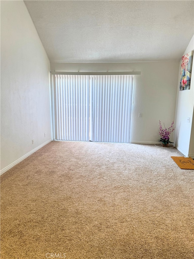 1480 W Edgehill Rd Unit 58, San Bernardino, CA 92405 - unfurnished room with carpet floors and a textured ceiling