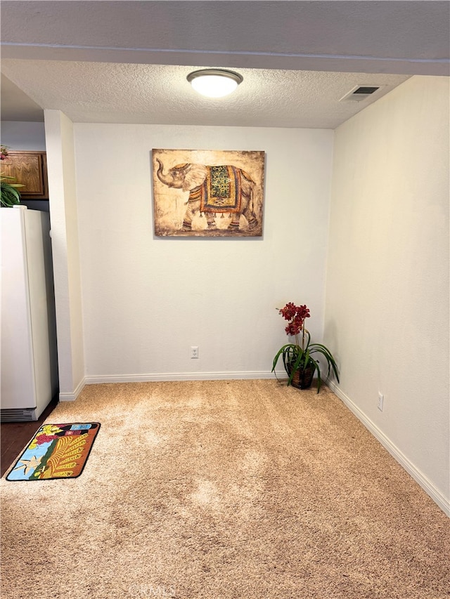 1480 W Edgehill Rd Unit 58, San Bernardino, CA 92405 - spare room with carpet floors and a textured ceiling