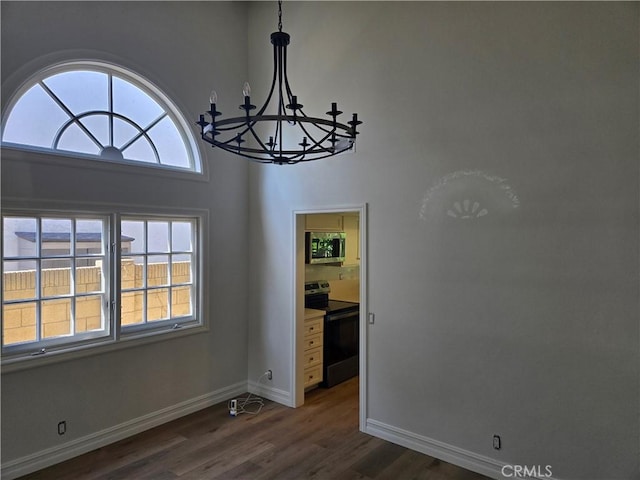 10281 Kings St, Los Alamitos, CA 90720 - unfurnished dining area featuring a chandelier and dark wood-style flooring